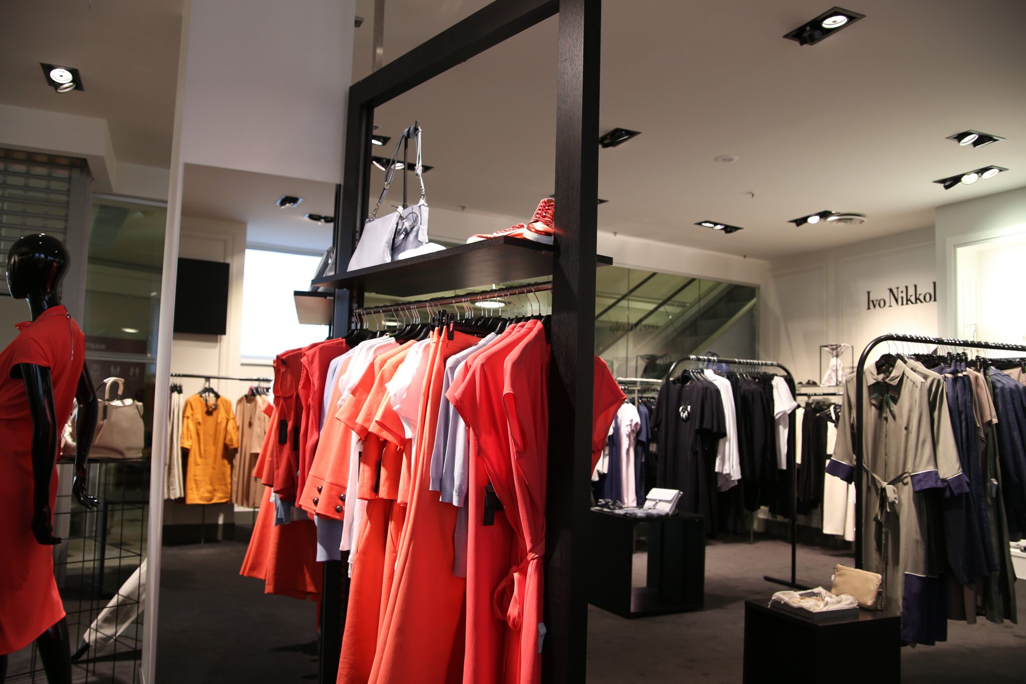 Freestanding Clothing Display Racks manufactured by Techrail Fabricated metal garment rails and display racks for retail interiors.