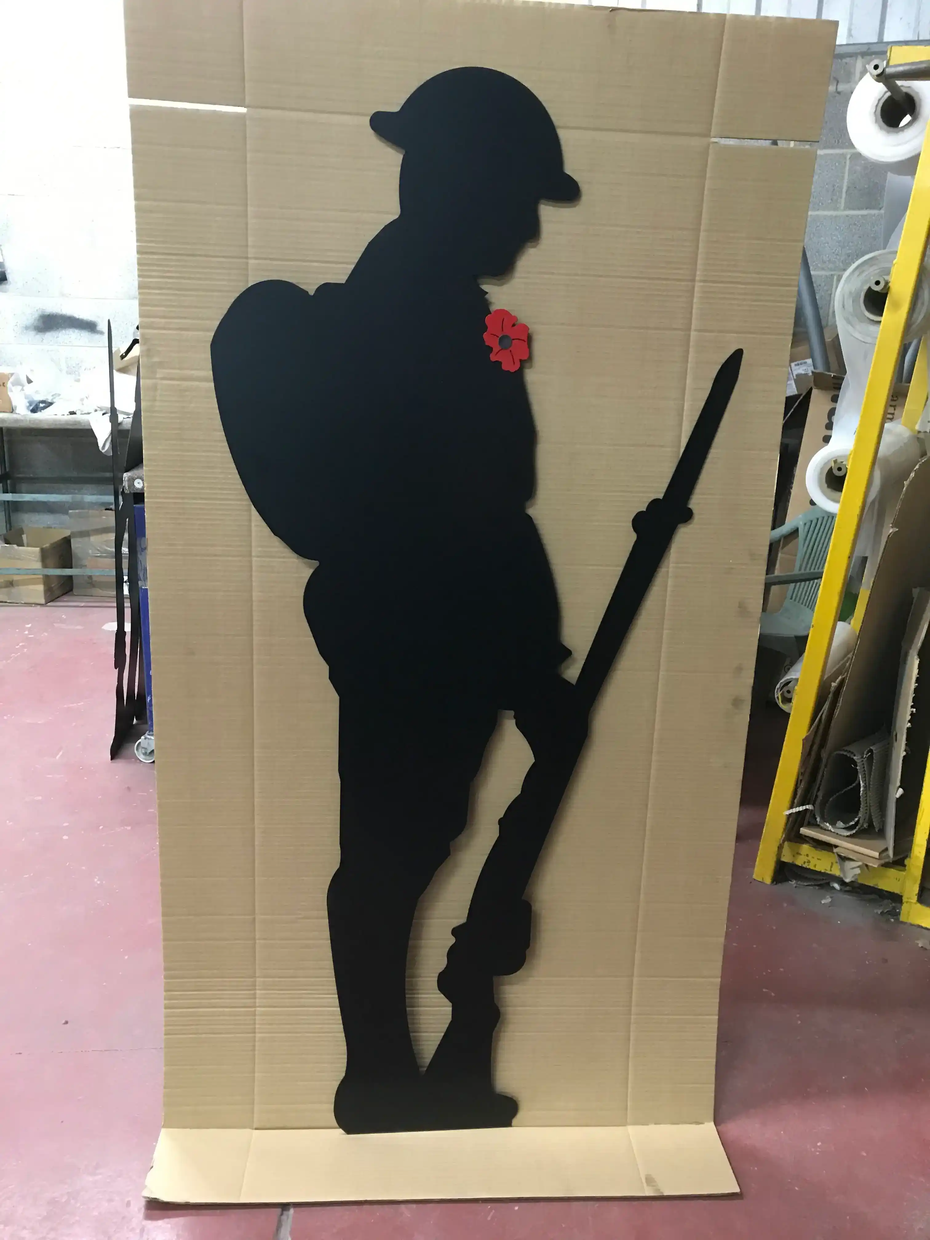 Remembrance Soldier Steel Silhouette manufactured by Techrail Powder-coated memorial silhouette precision cut from steel and finished with a red poppy detail.
