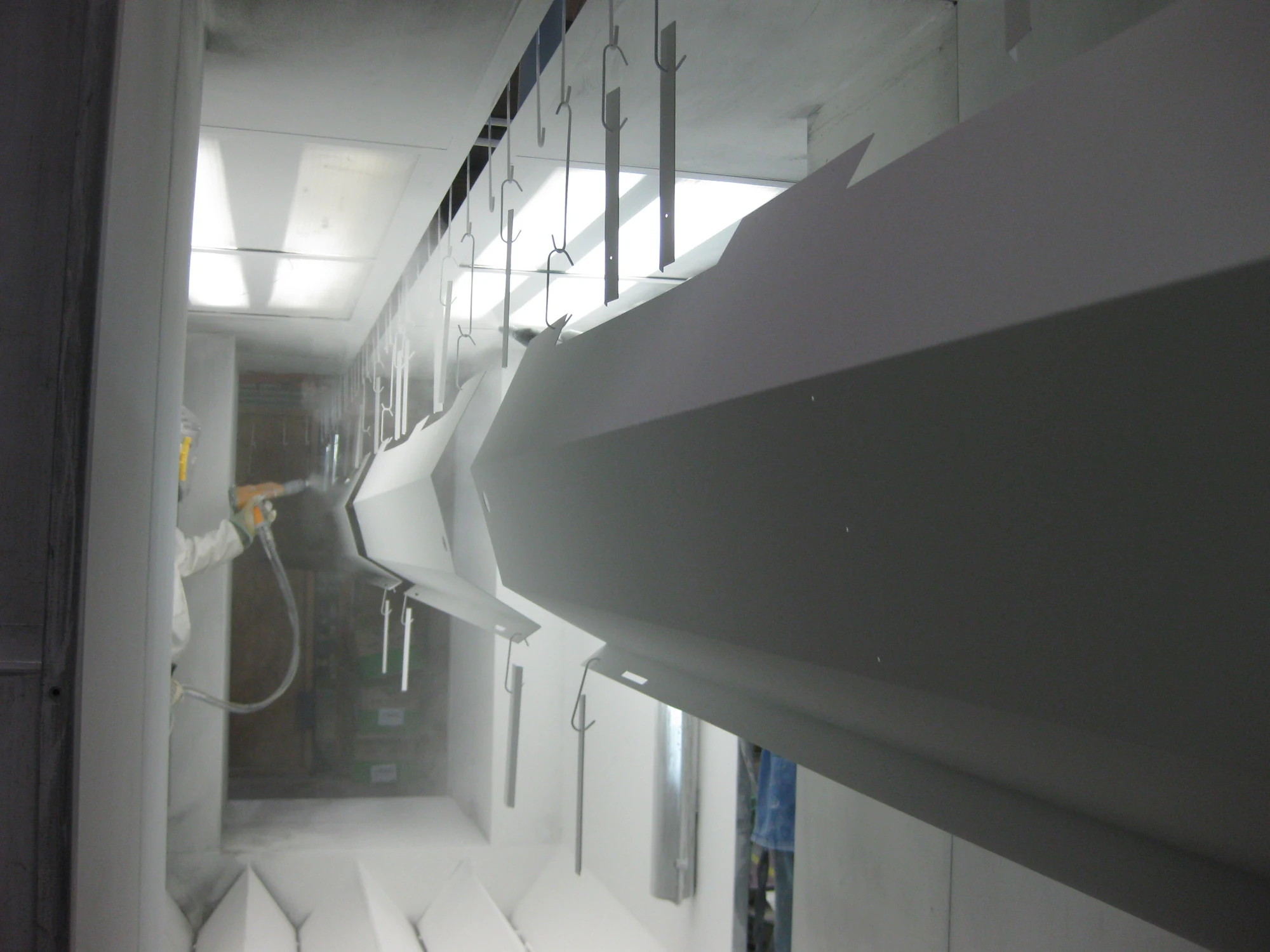Large fabricated metal products being powder coated at Techrail